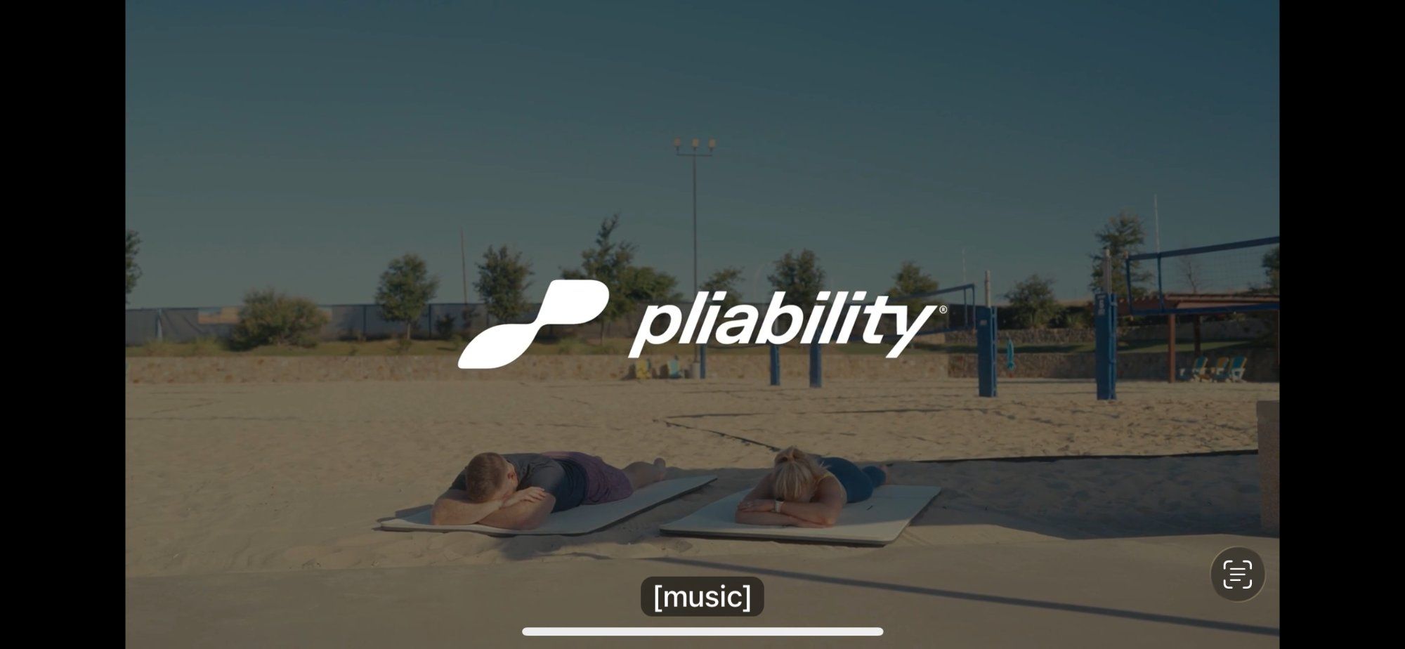 A Pliability rebound pause: two people lying face down on mats on a beach with the Pliability logo, calming music playing in the background